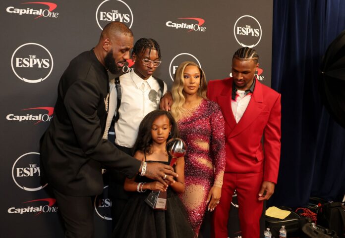 LeBron James hypes his “twin” Bryce James as he jams around with Savannah James and Zhuri in background