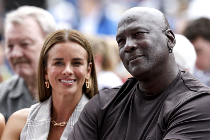 Michael Jordan and wife, Yvette Prieto, seemingly look frustrated at Cowboys-Eagles NFL season opener amid rain delay 